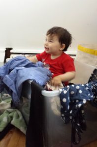 My son, "helping out" with the clothes declutter.